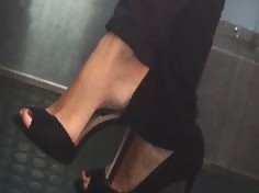 Beautiful feet in shoes high heels in train 4