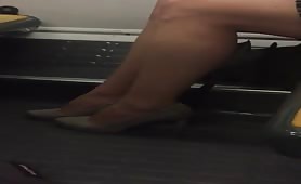 Beautiful feet in shoes high heels in train 9