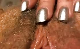 Blonde Rubs out Hairy Pussy Up-close on Cam